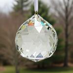 Asfour 2 inch Crystal Ball Suncatcher Prism. Hangs by a white satin ribbon.